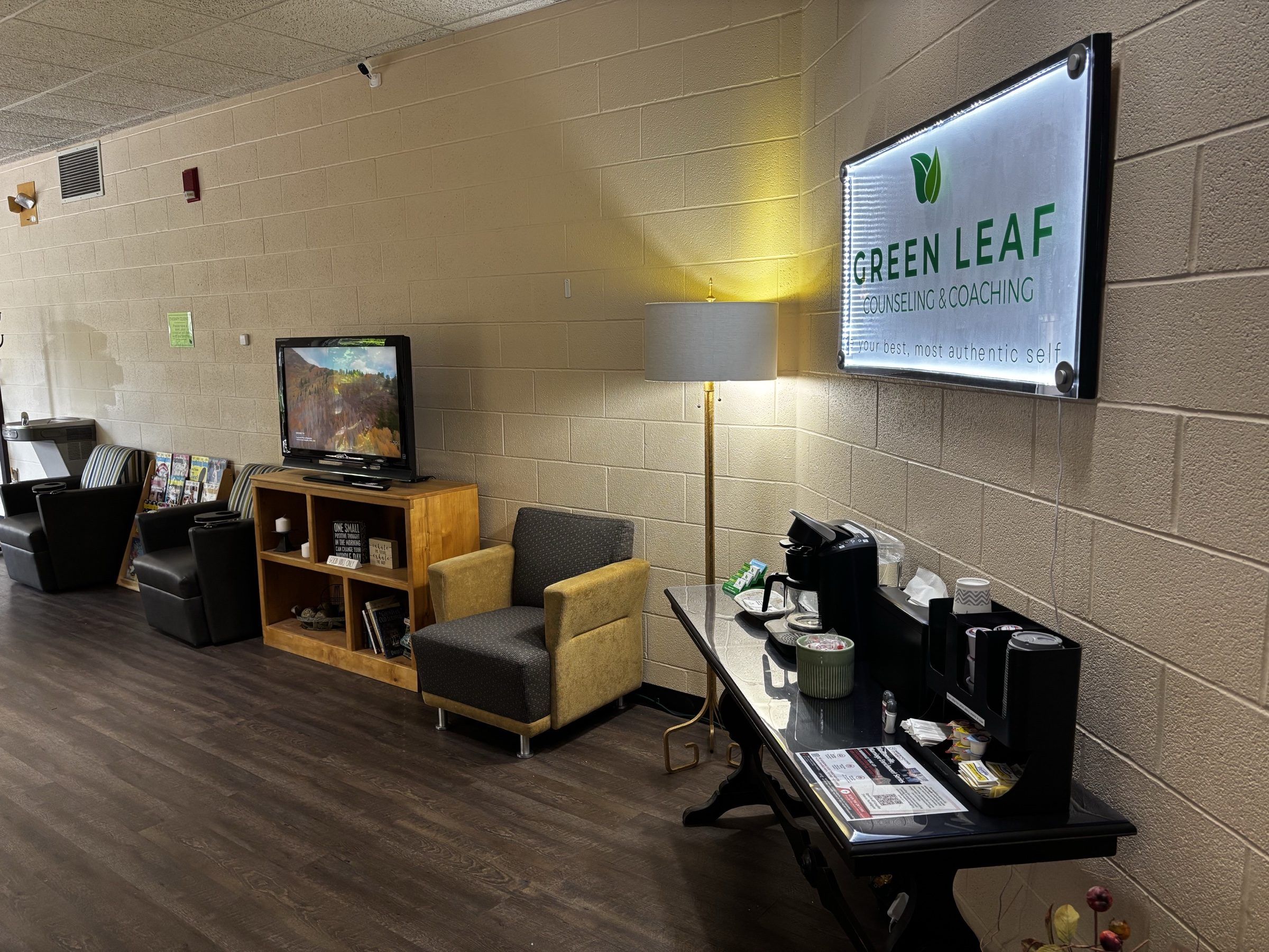 Green Leaf waiting area with the practice banner on the wall